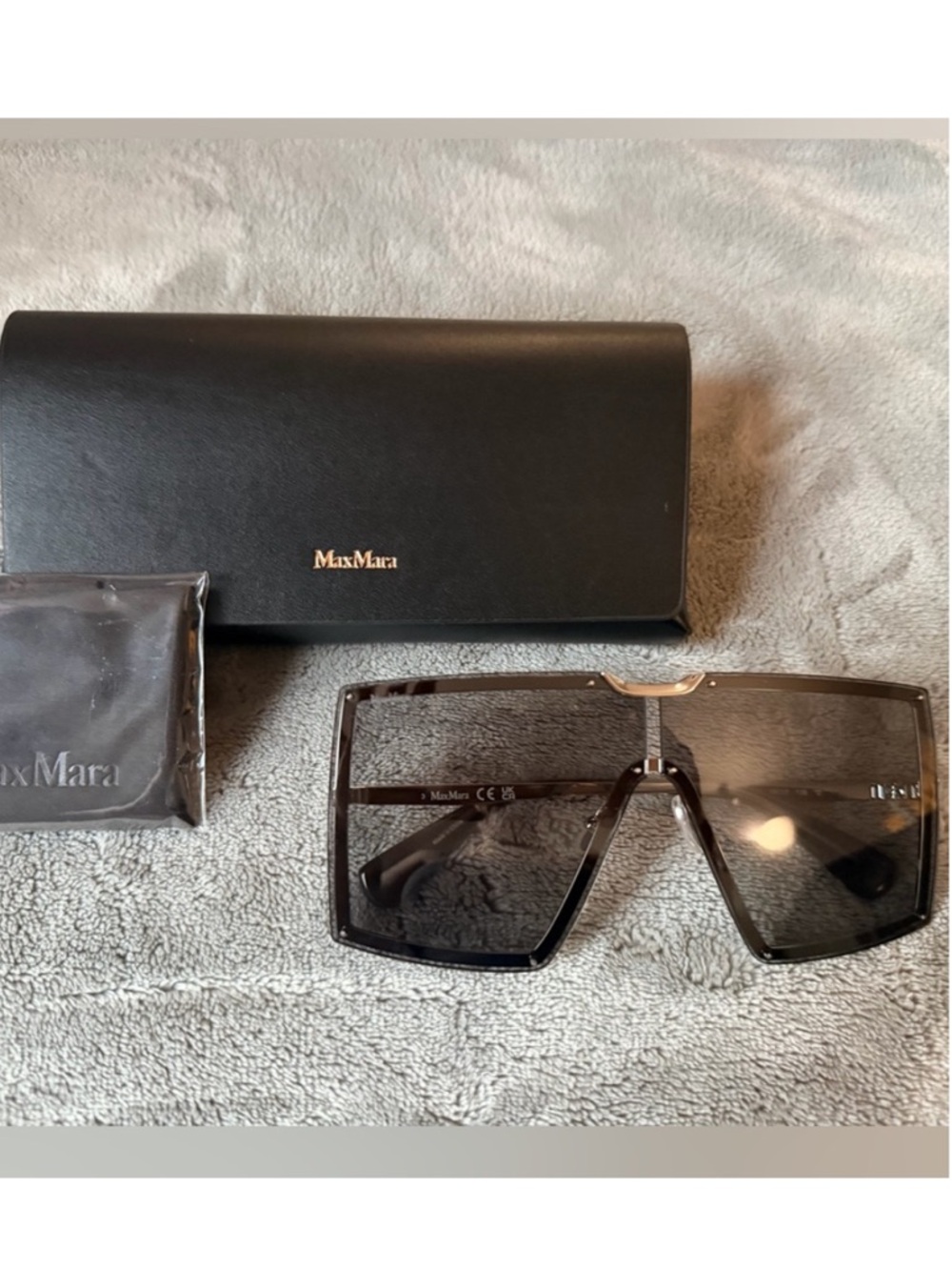 MaxMara Shield Sunglasses in black with grey gradient lenses. Gold hardware